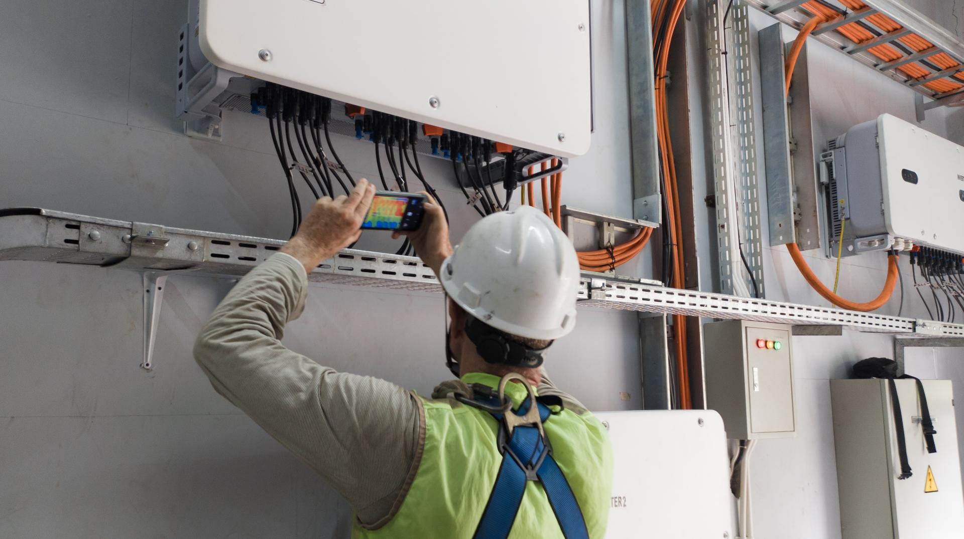 Electrician inspecting installations